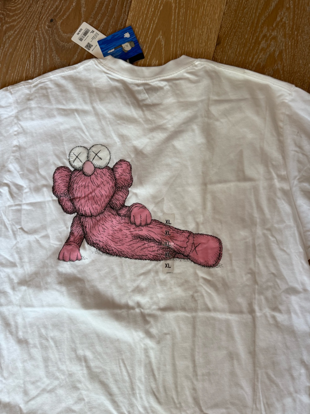 KAWS × Uniqlo UT Short Sleeve Graphic
T-shirt Size XL Pink BFF new - Picture 12 of 12